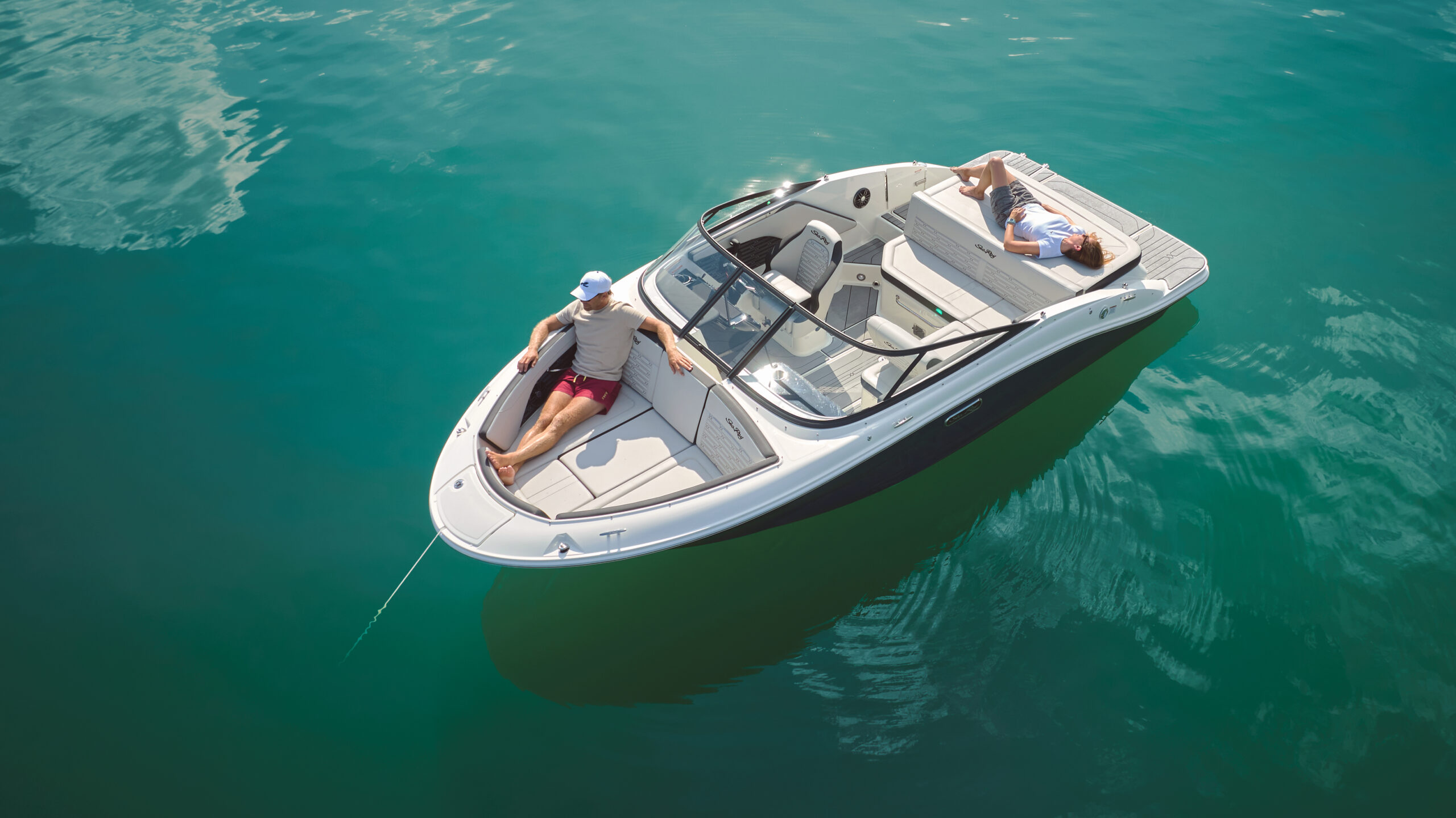 Aerial view of a couple lounging aboard an SPX 190