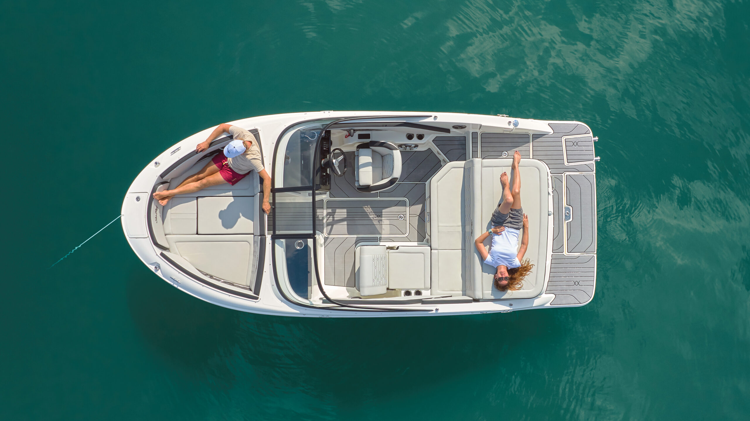 Aerial view of a couple lounging aboard an SPX 190