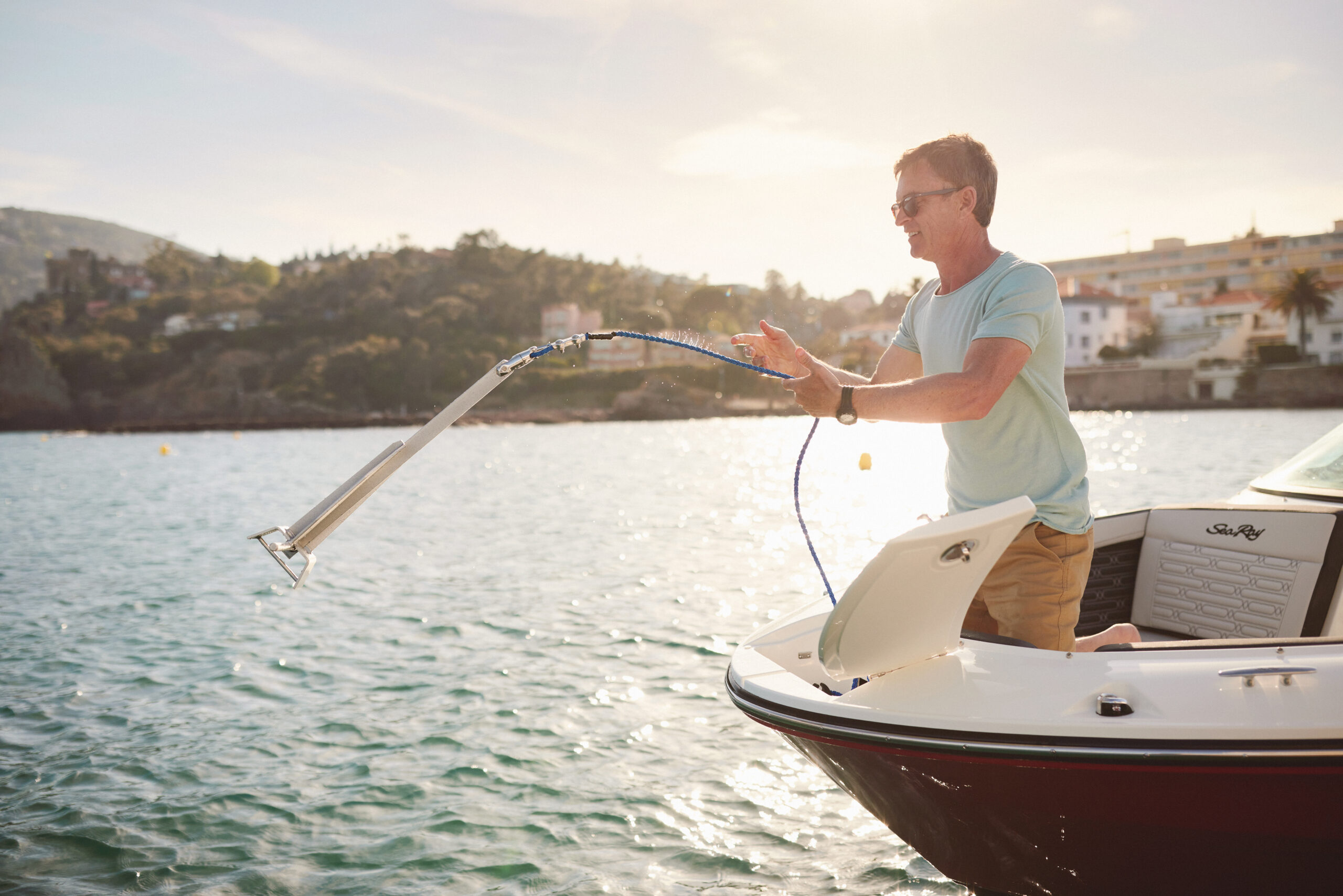 Man lowering the anchor from an SPX 210 Outboard